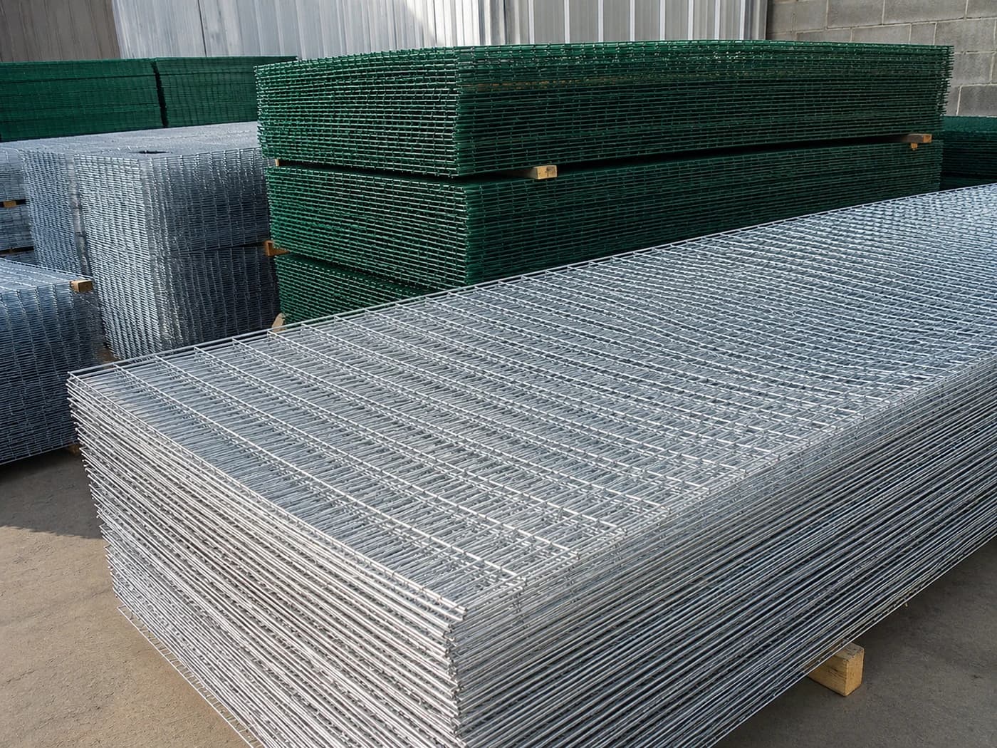 Stacks of galvanized welded mesh panels representing steel and galvanized materials supplied by SOK Steel & Agro Solutions