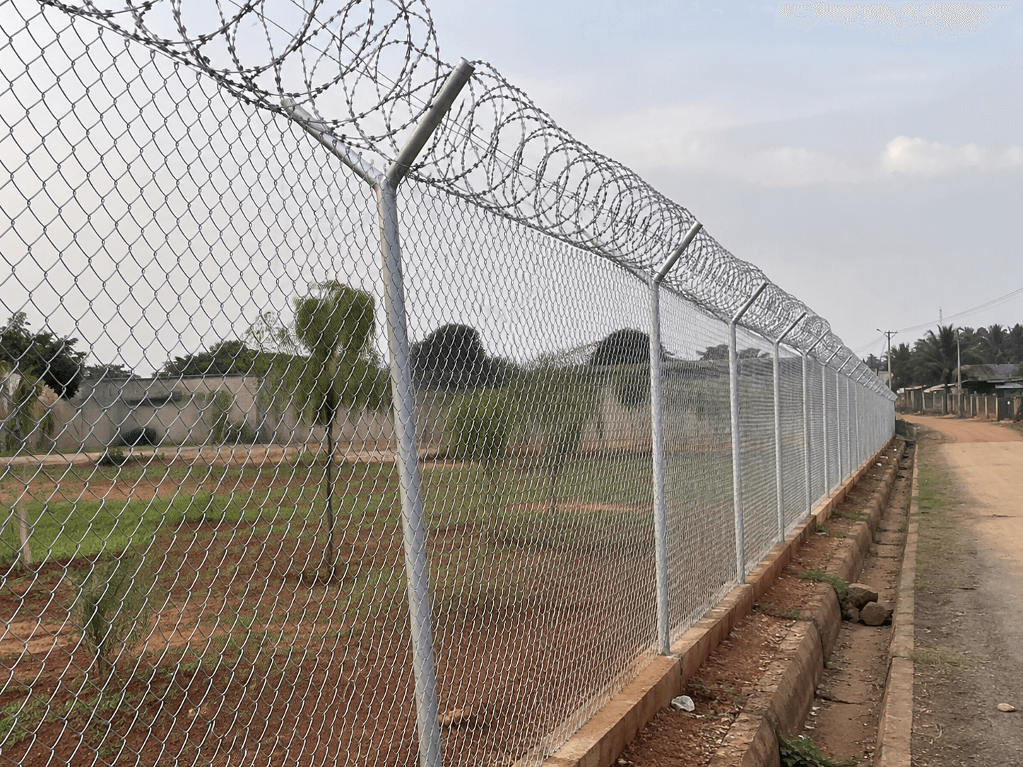 High-security chain-link and razor-wire perimeter project completed by SOK